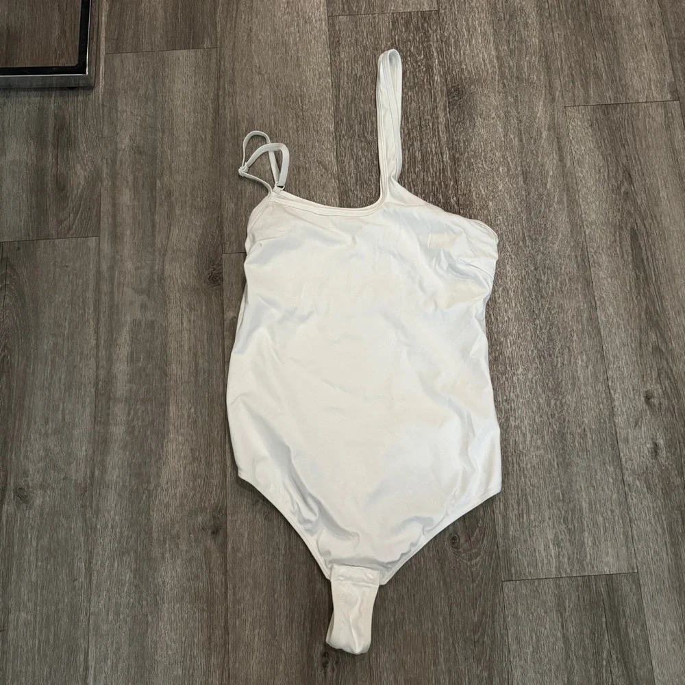 White asymmetrical thong bodysuit